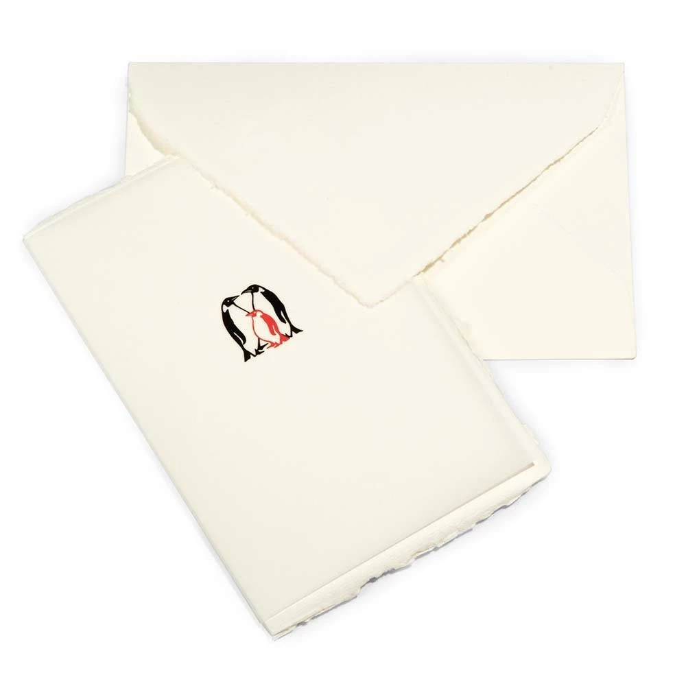 Greeting card baby penguin laid paper