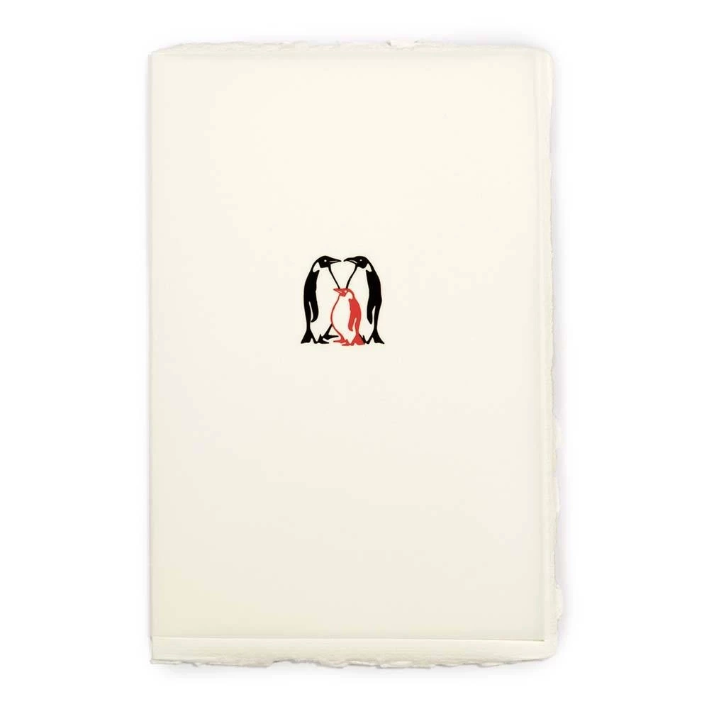 Greeting card baby penguin laid paper